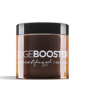 A jar of Edge Booster strong hold styling gel in dark brown sits against a black background. 
