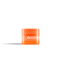 A bright orange jar of Edge Booster hair pomade sits against a black background. 
