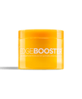 A bright yellow jar of Edge Booster extra strength hair pomade sits against a black background. 
