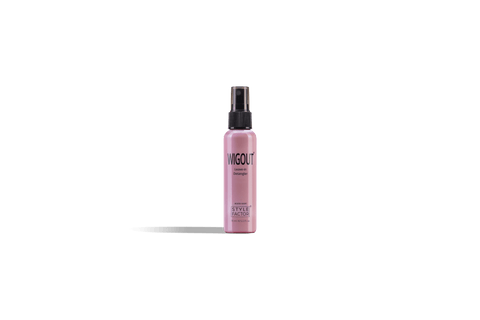 A pink bottle of Style Factor Wig Out Leave-in Detangler stands against a black background. 
